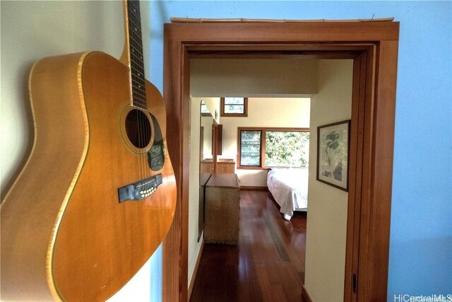 hallway with dark wood-type flooring