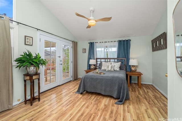 bedroom with vaulted ceiling, access to outside, wood finished floors, and french doors