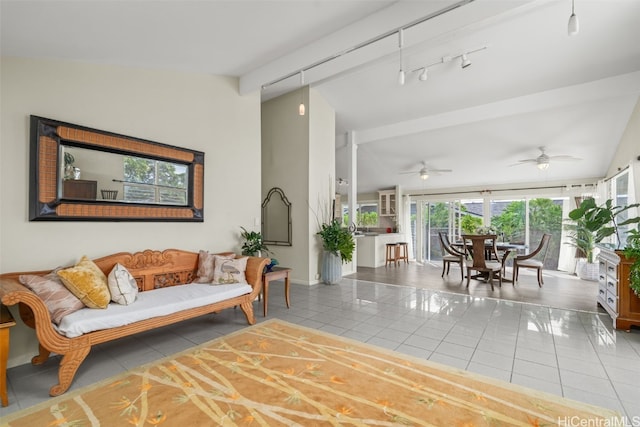 living room featuring tile patterned floors, lofted ceiling, a ceiling fan, and rail lighting