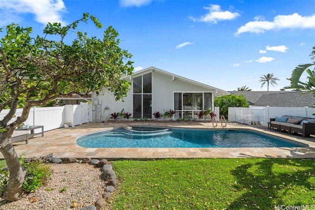 view of pool with a fenced in pool, a patio, a fenced backyard, and a sunroom