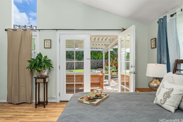251 Kalalau St, Honolulu, HI 96825 - bedroom featuring lofted ceiling, multiple windows, access to exterior, and wood finished floors