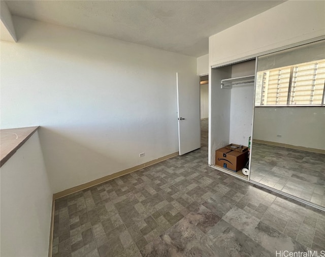 unfurnished bedroom with a closet