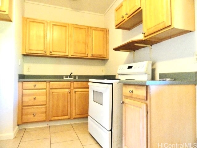 kitchen with electric range, sink, and light tile patterned floors