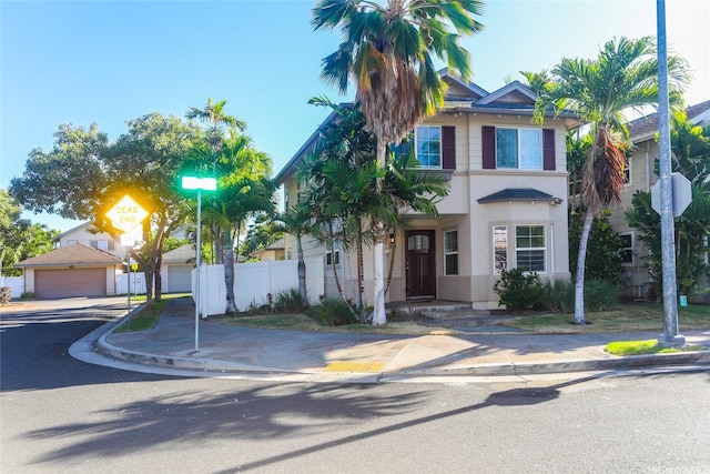 91-1001 Kaihi St, Ewa Beach, HI 96706 - view of front facade with fence, a garage, and stucco siding