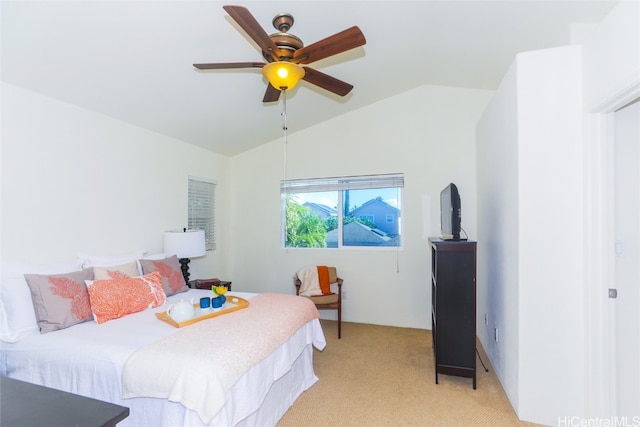 carpeted bedroom featuring ceiling fan and lofted ceiling