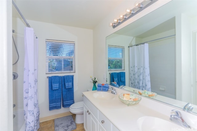 full bathroom with tile patterned floors, vanity, toilet, and shower / tub combo