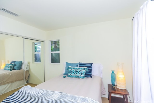 bedroom with carpet flooring and a closet