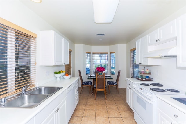 kitchen with white appliances, white cabinets, sink, light tile patterned flooring, and extractor fan