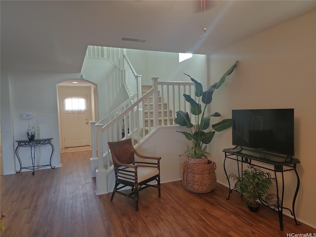 91-1001 Kaihi St, Ewa Beach, HI 96706 - living area with wood finished floors, stairs, and arched walkways