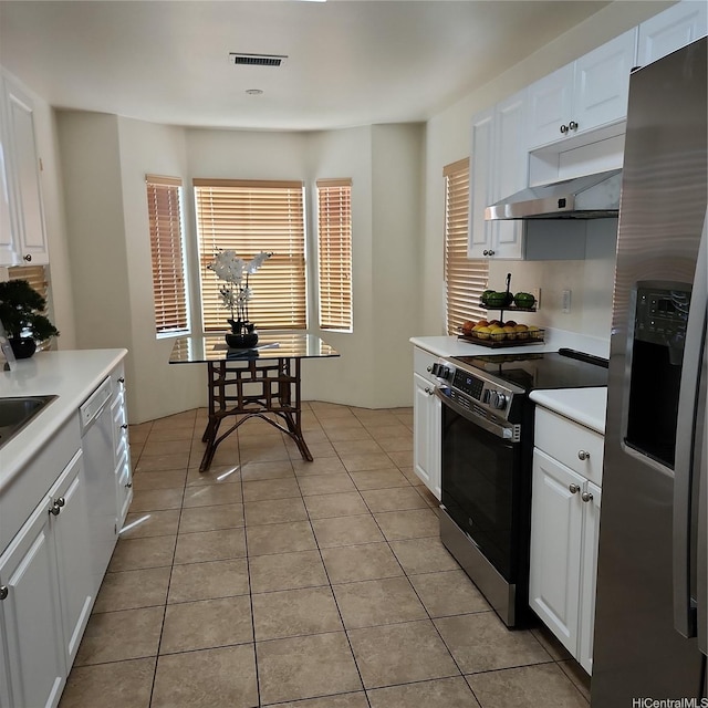 91-1001 Kaihi St, Ewa Beach, HI 96706 - kitchen with appliances with stainless steel finishes, light countertops, and white cabinetry
