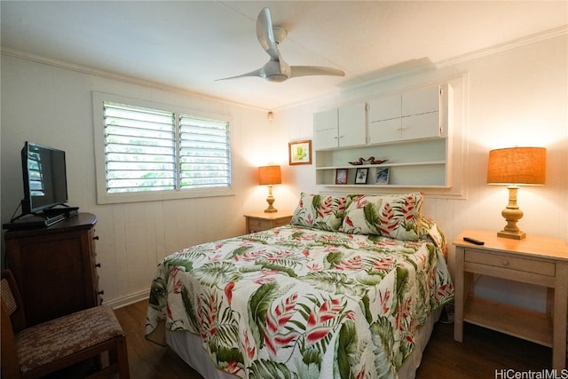 bedroom featuring ceiling fan, dark hardwood / wood-style flooring, and ornamental molding