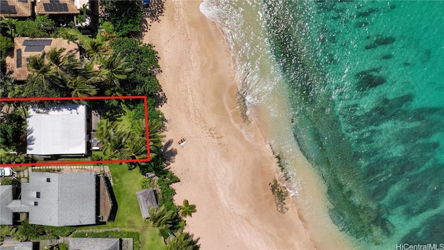 bird's eye view with a water view and a beach view