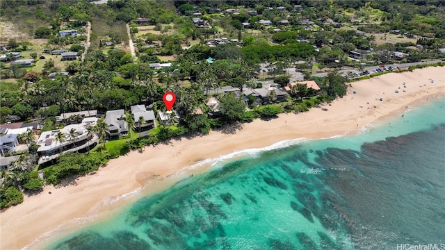 aerial view with a water view and a beach view