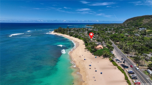 drone / aerial view with a view of the beach and a water view