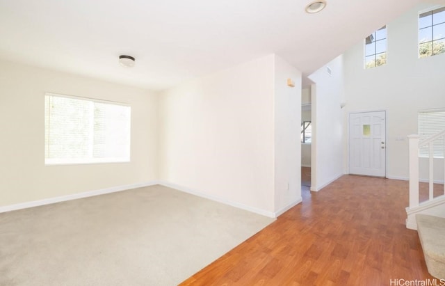 unfurnished room with hardwood / wood-style flooring