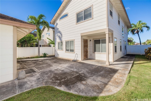 rear view of property featuring a patio area