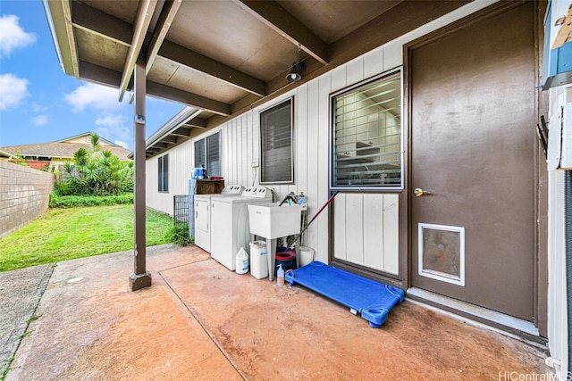 exterior space featuring washer and clothes dryer