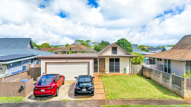 view of front of house with a front lawn and a garage