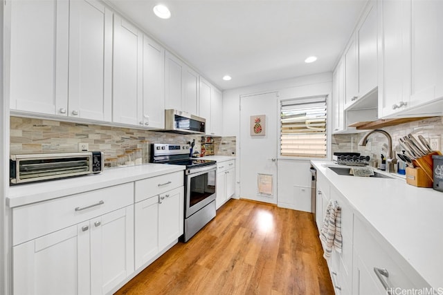 kitchen featuring white cabinets and stainless steel appliances