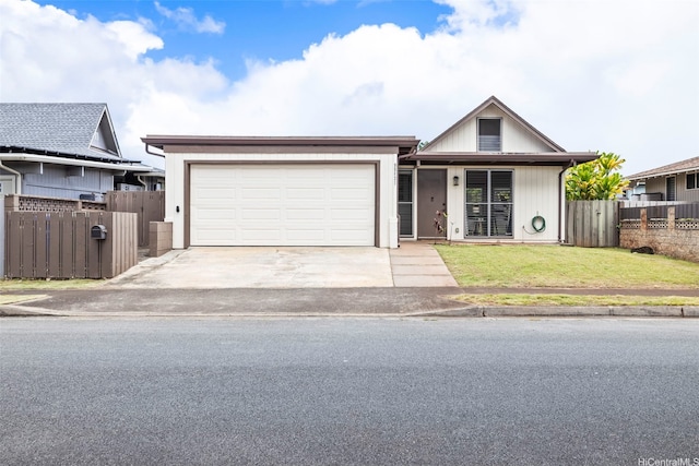 ranch-style home with an attached garage, concrete driveway, a front yard, and fence