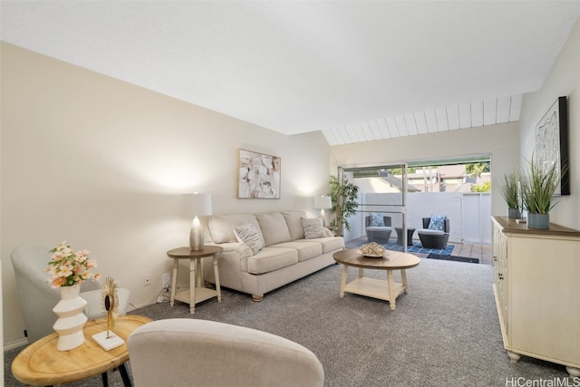 carpeted living room with lofted ceiling