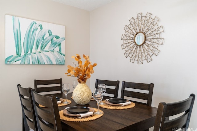 dining area featuring a textured ceiling