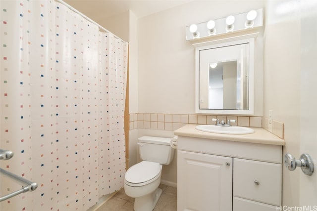 bathroom with a shower with curtain, tile patterned flooring, vanity, and toilet