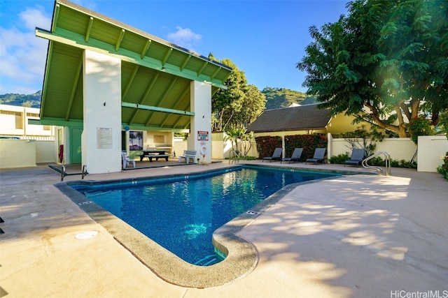 view of swimming pool with a gazebo and a patio