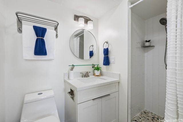 bathroom featuring vanity, toilet, and a tile shower