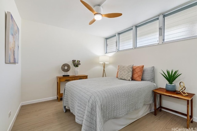 bedroom featuring light wood-type flooring and ceiling fan