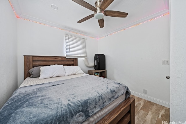 bedroom with ceiling fan and light wood-type flooring