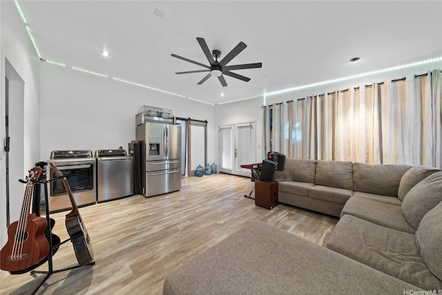 613 Kalakaua St, Wailuku, HI 96793 - living room featuring ceiling fan, separate washer and dryer, light wood finished floors, a barn door, and recessed lighting