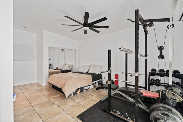 tiled bedroom featuring ceiling fan