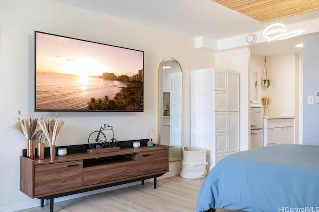 bedroom with light wood-type flooring and wood ceiling