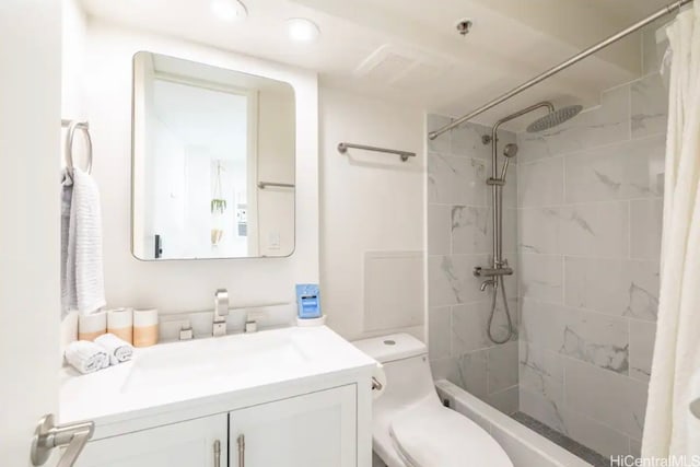 bathroom featuring vanity, curtained shower, and toilet