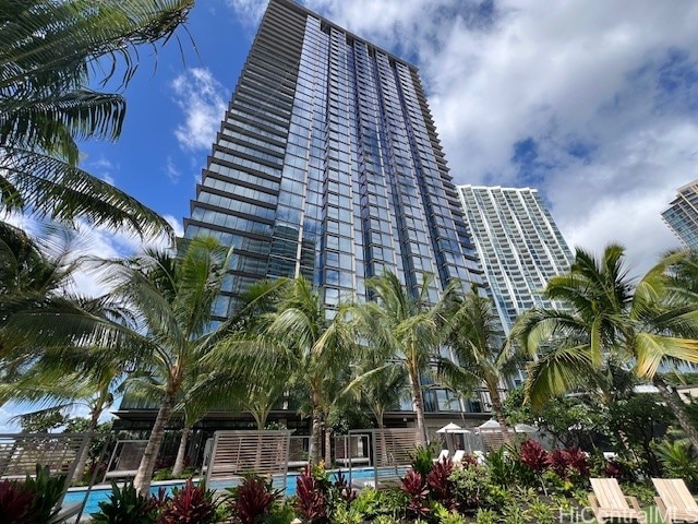 view of building exterior with a community pool