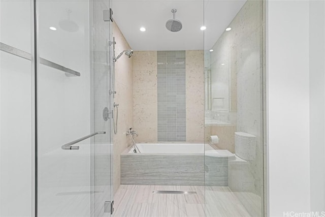 bathroom with a shower stall and a bath