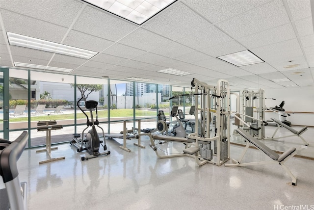 exercise room featuring expansive windows