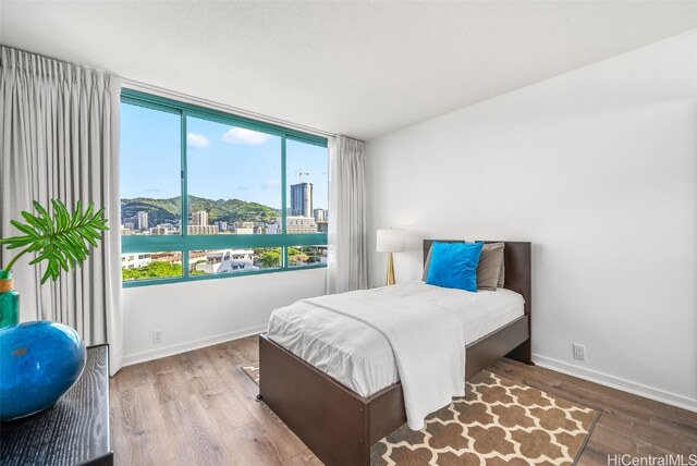 bedroom with hardwood / wood-style flooring