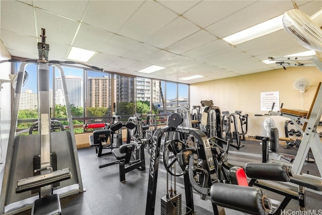 exercise room featuring a paneled ceiling