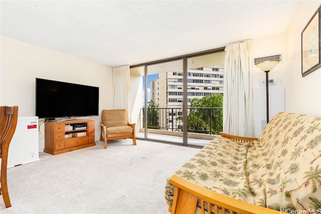 living area featuring floor to ceiling windows and light colored carpet