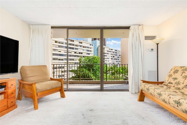 411 Hobron Ln Unit 703, Honolulu, HI 96815 - sitting room featuring floor to ceiling windows and carpet flooring
