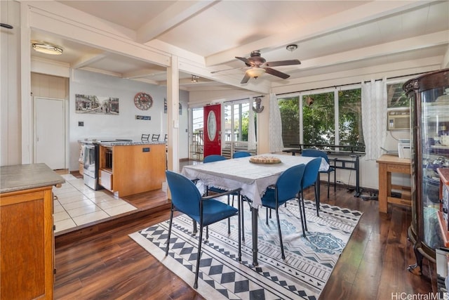 dining room featuring ceiling fan, hardwood / wood-style flooring, and beamed ceiling