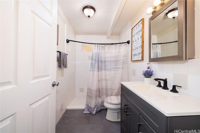 bathroom with walk in shower, tile patterned floors, toilet, tile walls, and vanity