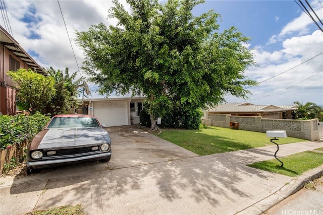 view of front of house featuring a garage and a front lawn