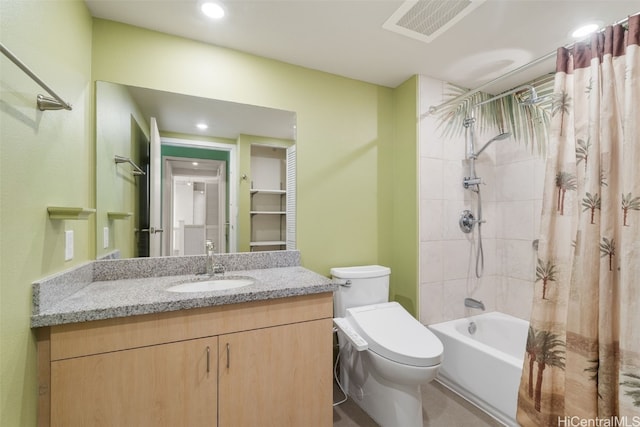 full bathroom featuring toilet, vanity, and shower / tub combo with curtain