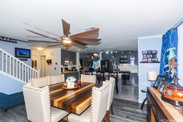 dining area with dark hardwood / wood-style floors, ceiling fan, and ornamental molding