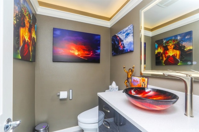 bathroom featuring crown molding, vanity, and toilet