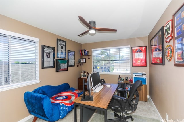 carpeted office with ceiling fan