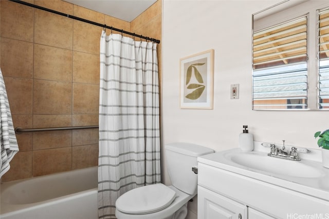 full bathroom featuring toilet, vanity, and shower / tub combo with curtain